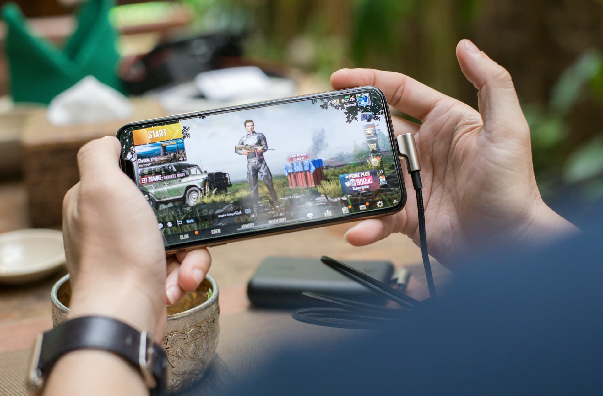 A player concentrating on a timed game on their phone