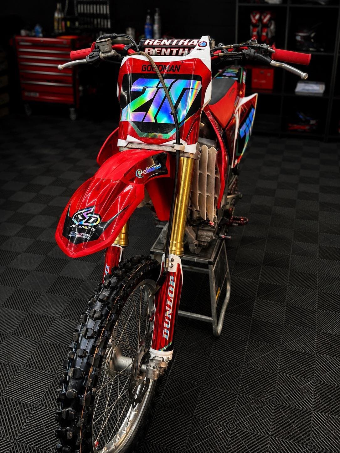 The Honda CRF 250 head on, showing the front number board and Renthal bars