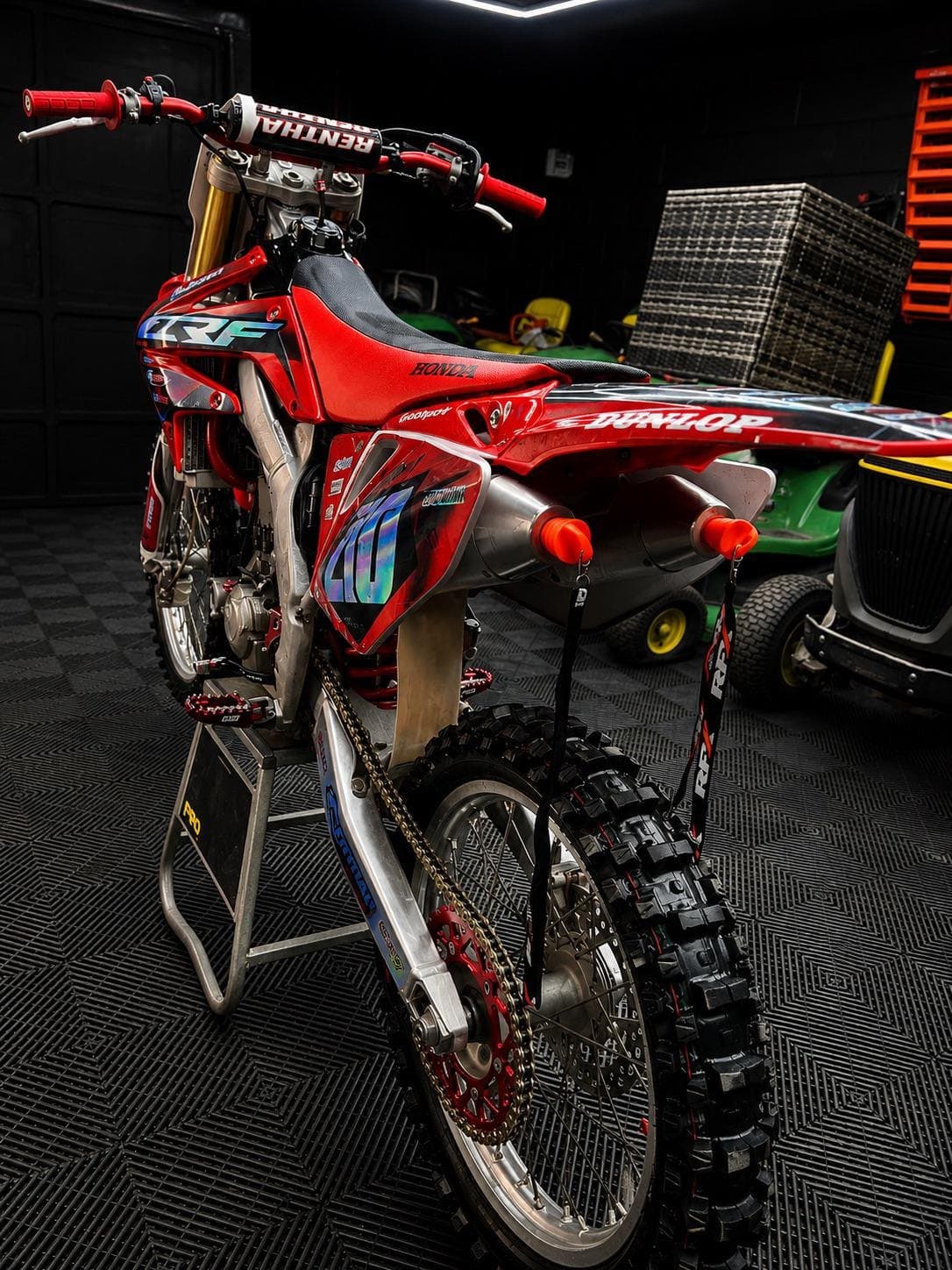 The Honda CRF 250 from behind, showing the rear wheel, chain and exhaust
